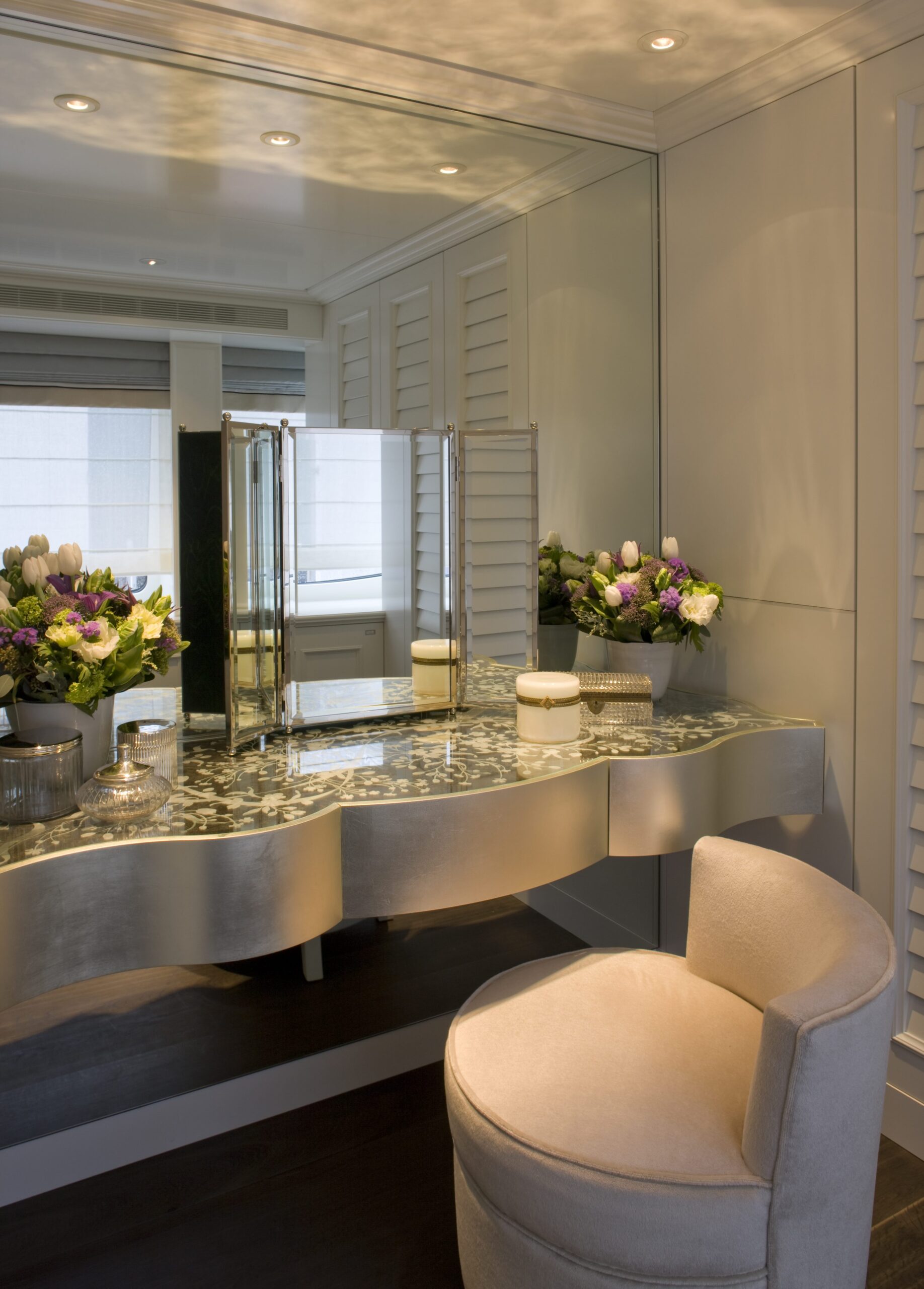 curved-vanity-table-mirror-folding-mirror-floral-arrangement-bedroom-corner-09