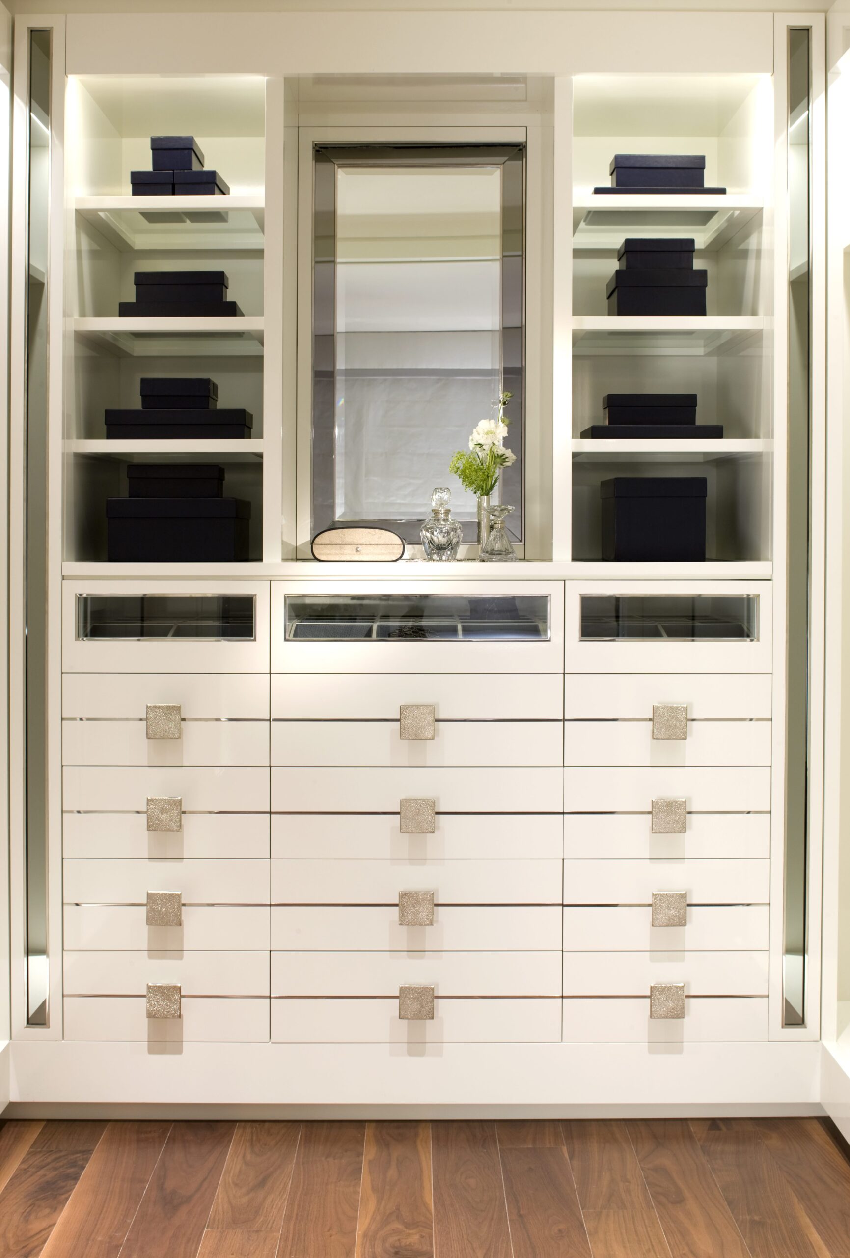 white-built-in-wardrobe-drawers-open-shelving-black-storage-boxes-centre-mirror-display- 02