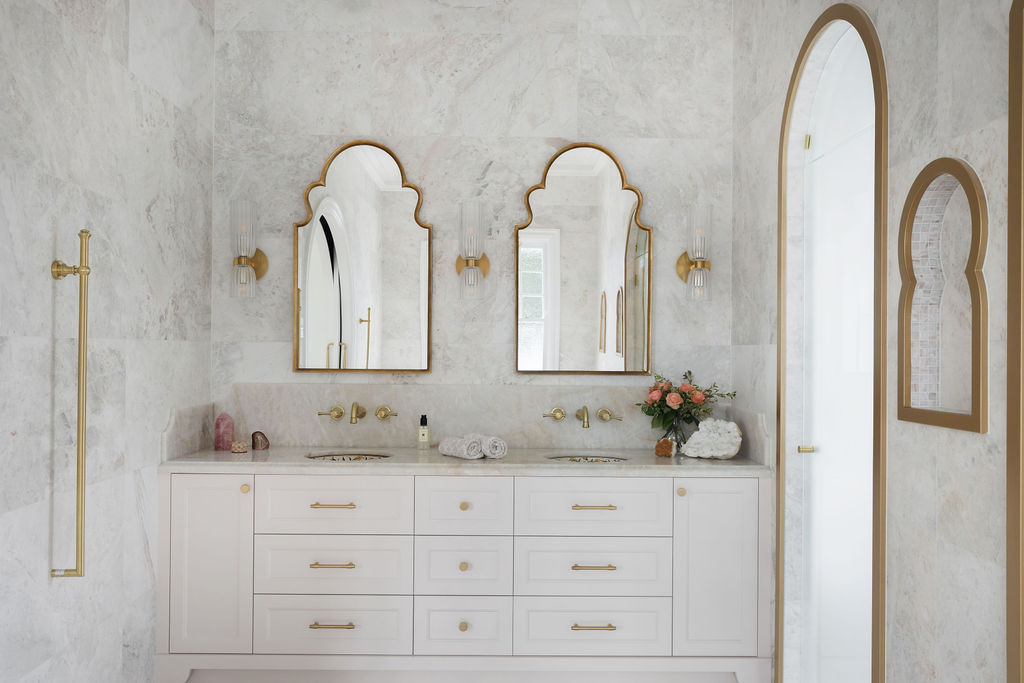 luxury-double-vanity-marble-bathroom-arched-mirrors-bella-vie-interiors